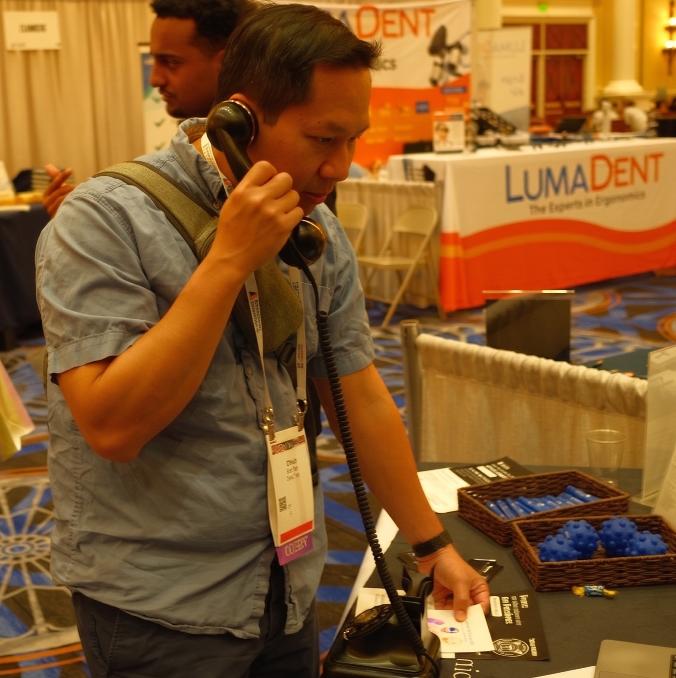 A dentist trying Echo on the rotary phone at the booth